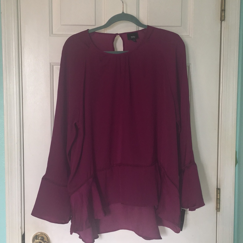 Magenta long sleeved blouse.